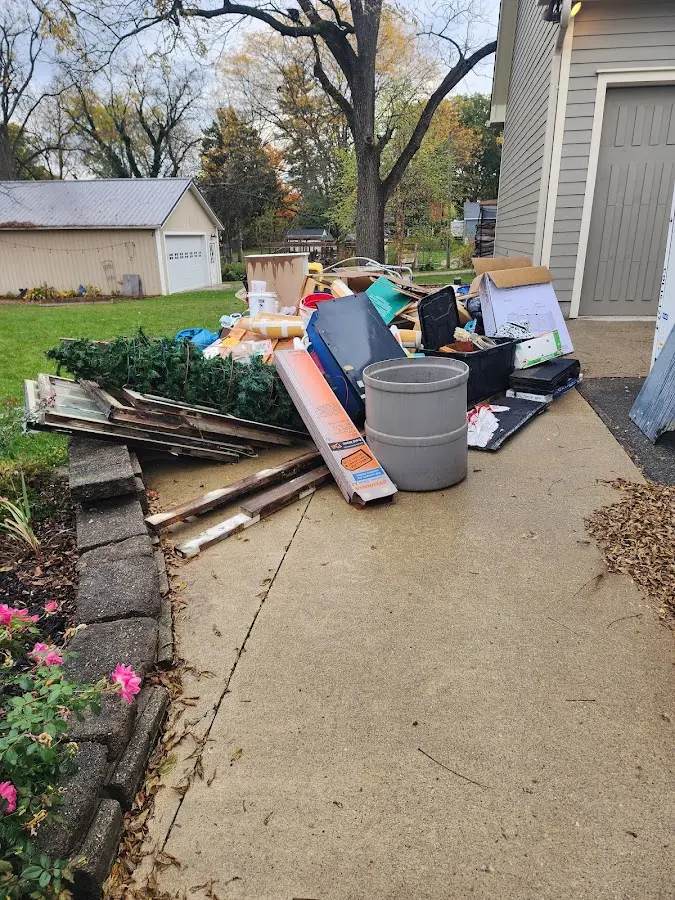 Dumpster being loaded with debris for 30 Yard Dumpster Rental in New Braunfels